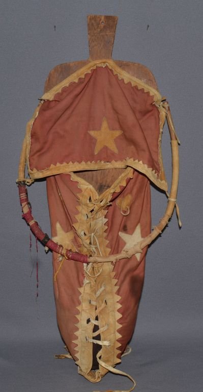 PLAINS CRADLE BOARD: 1930s cloth and hide, star design, beads on visor hoop, has bead loss, 25" tall Shipping charge are for the continental United States only There will be additional shipping fees on shipments to Hawaii
