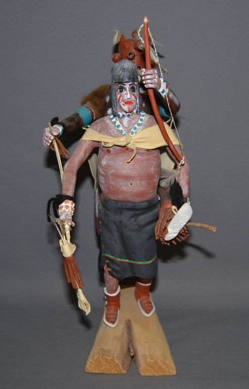 NAVAJO DOLL: 1980s pair, one carrying the other, carved cotton wood, 16" tall Shipping charge are for the continental United States only There will be additional shipping fees on shipments to Hawaii, Alaska and ou