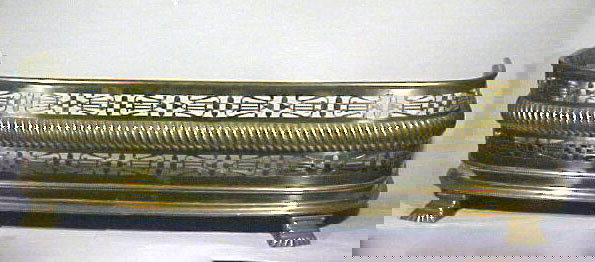 Antique Classical Brass Fireplace Fender Lyre Harps: Here is an absolutely stunning classical fireplace fender. It is all in brass with stylized or very classical paw feet. It has cutwork figures of classical lyre harps all the way across the front and