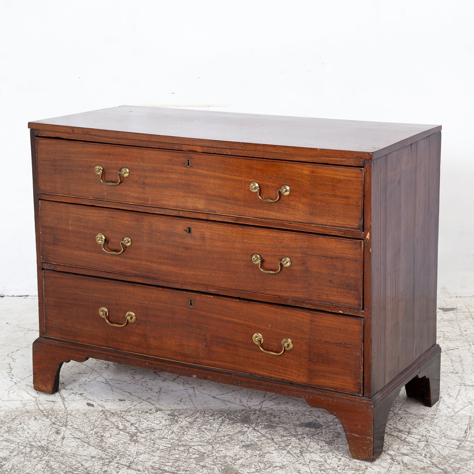 George III Mahogany Chest of Drawers: * (34 1/4" h x 45 1/8" w x 20 3/4" d) Sun fade throughout, age cracks to top and sides, lifting to veneers on sides, feet later raised, old marks and scratches, scuffs to feet.
