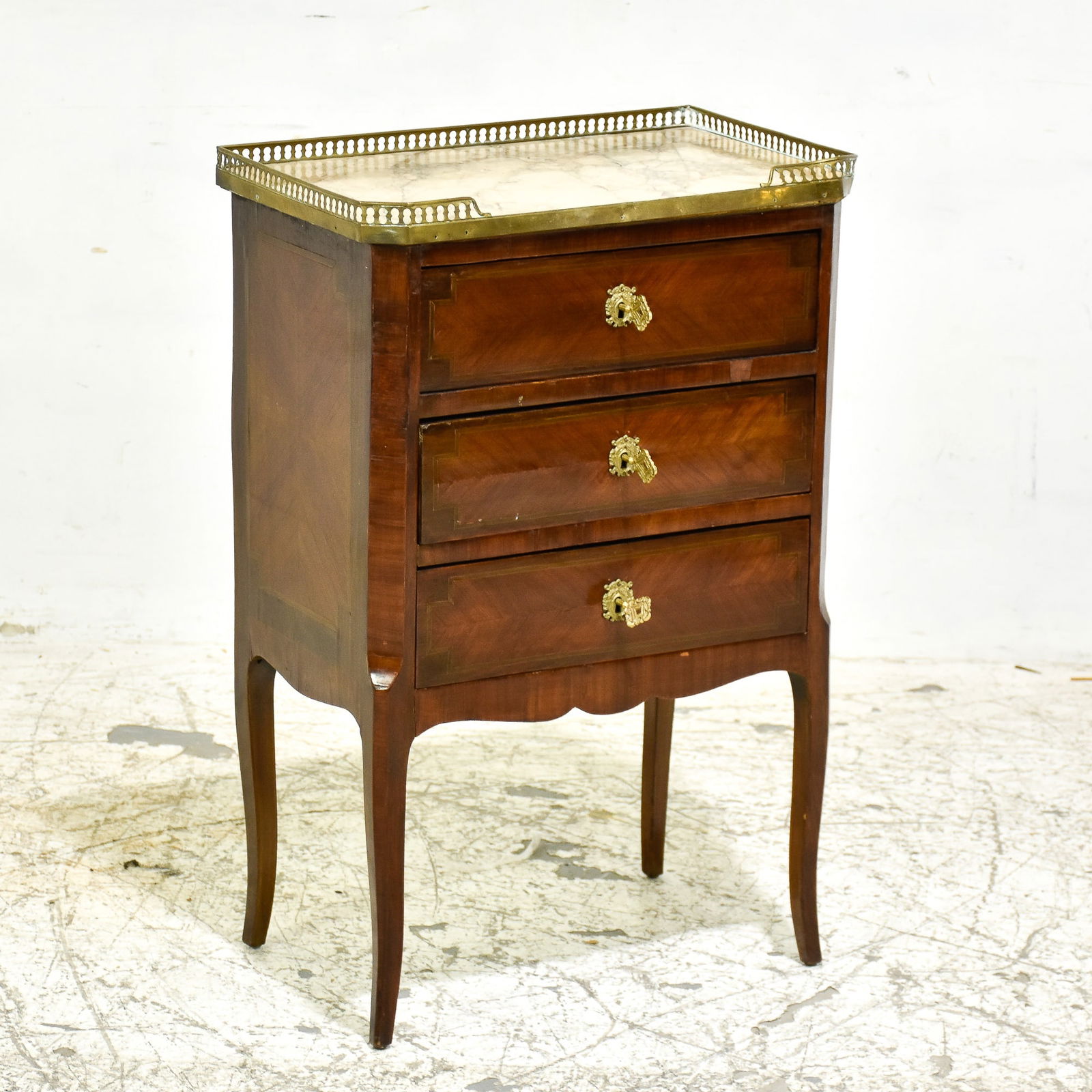 Louis XV/XVI Style Inlaid Kingwood Commode: * (30” h x 19 3/4” x 12 1/2” d) Bends, dings and dents to gallery, chips to veneers