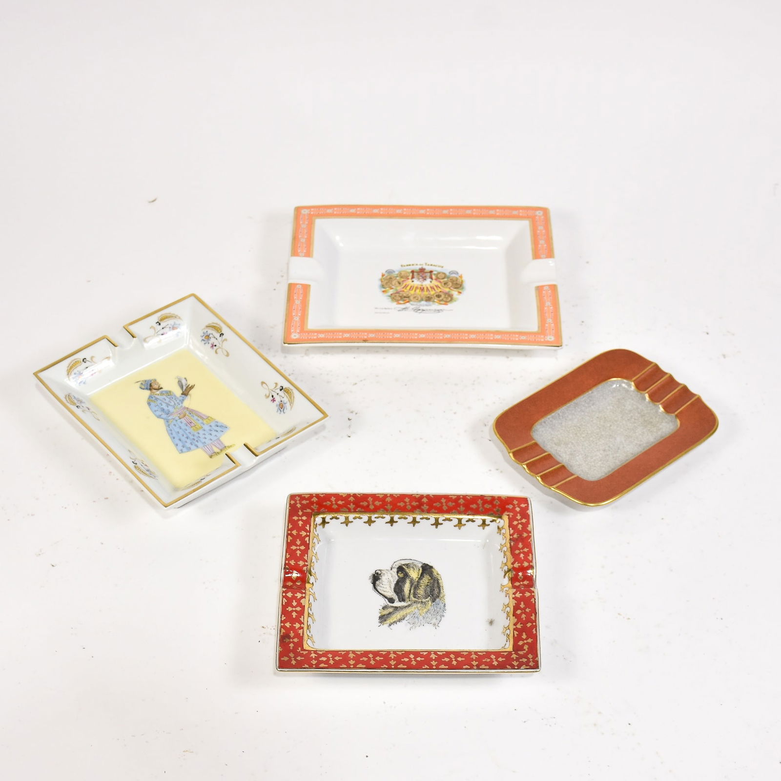 Group of 4 Porcelain Ashtrays: Including Hermes example * (Largest 1" h x 9 1/2" w x 7 5/8" d) Good