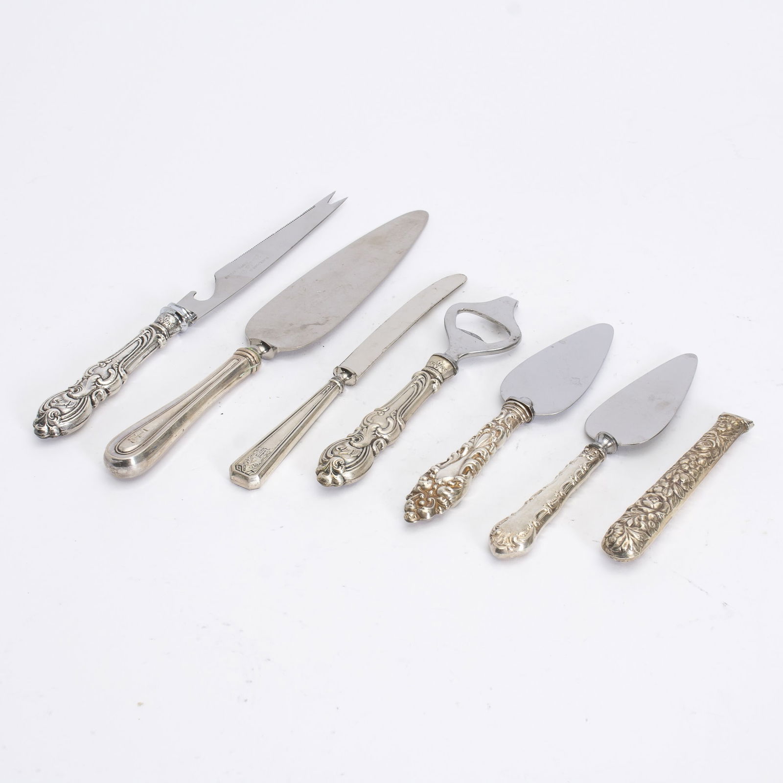 Group of Six Sterling Silver Handled Serveware: Ap. 10.69 ounces weighted (Largest 9 1/2" l) one broken