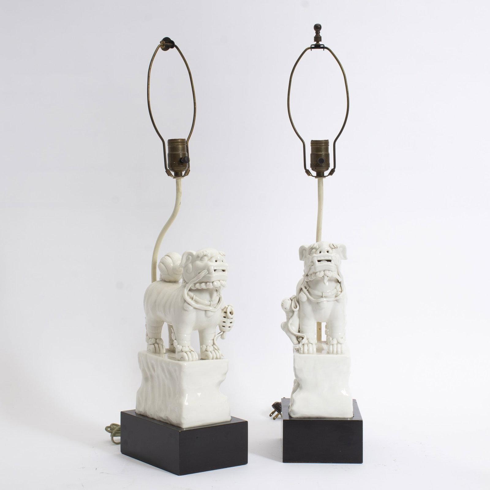 Pair of White Porcelain Fu Dogs: Mounted as lamps * (29" h) Untested, cracks