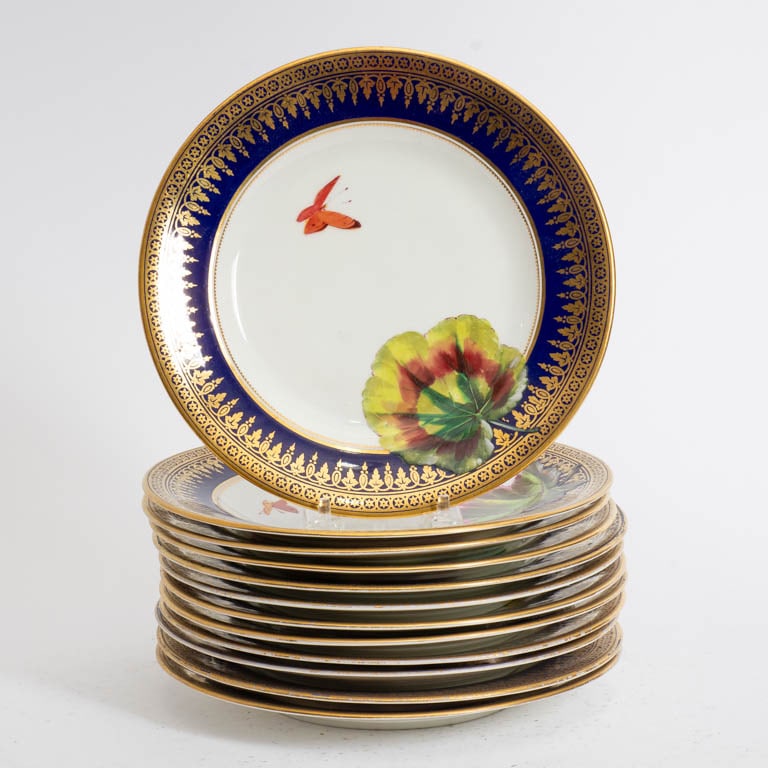 Set of Twelve Gilt Rimmed Paint Decorated Plates: * (9" dia) Rubbing to gilt, minor loss to paint
