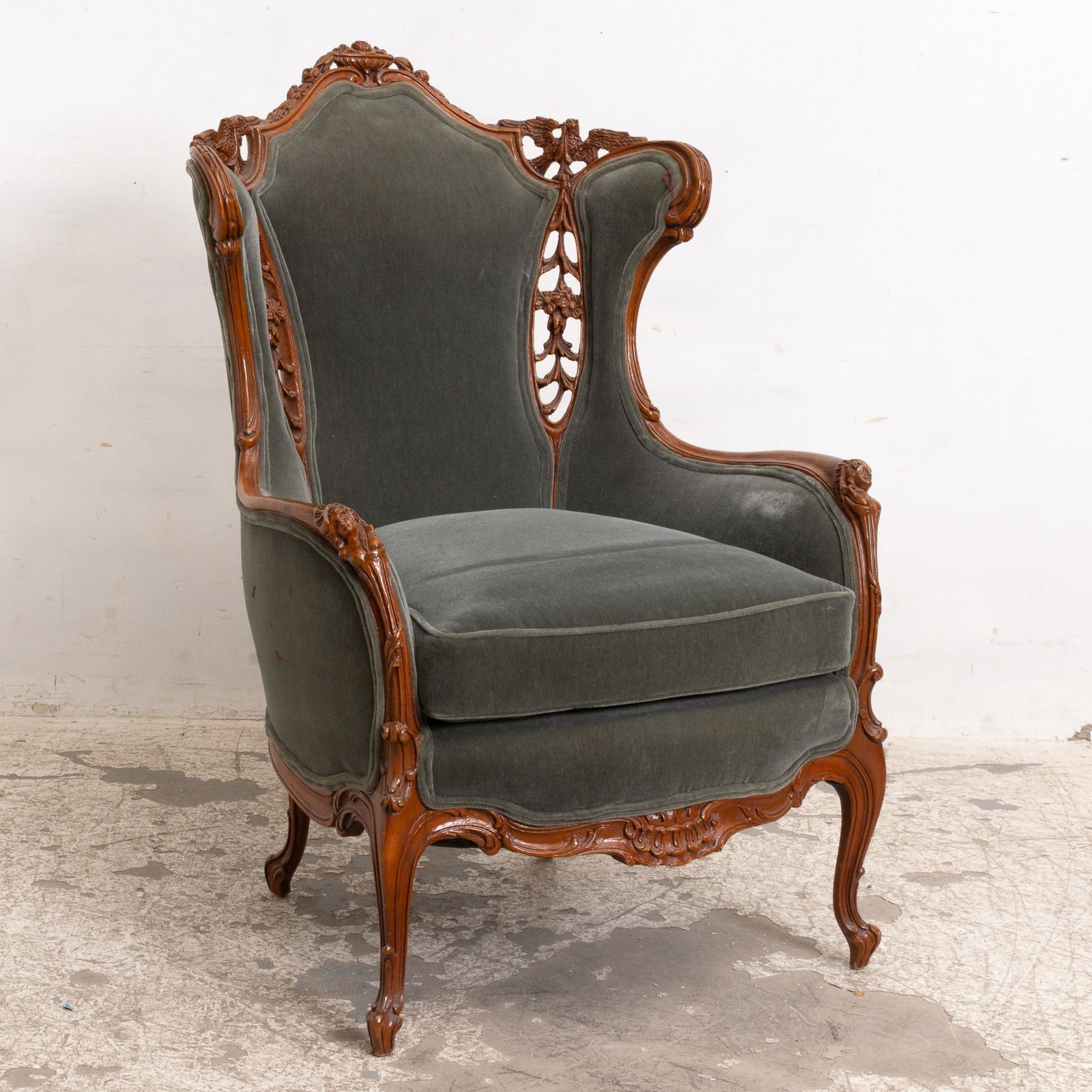 Rococo Revival Carved Wood Upholstered Wing Chair: Late 19th/early 20th century 47" h x 30 1/2" w x 25" d Seat to Floor 20" h