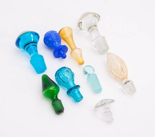 Group of Ten Colored Glass Decanter Stoppers