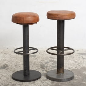 Two Leather Upholstered Patinated Metal Bar Stools