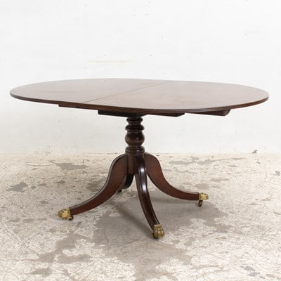 Mahogany Dining Table: With leaves (29 1/2" h x 62" w x 42" d Leaves 24" w) Scratches and dings