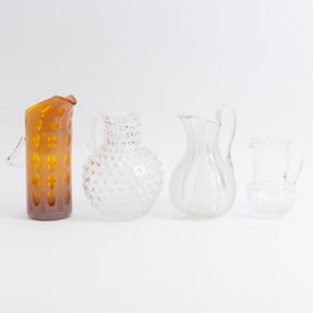 Group of Four Glass Pitchers