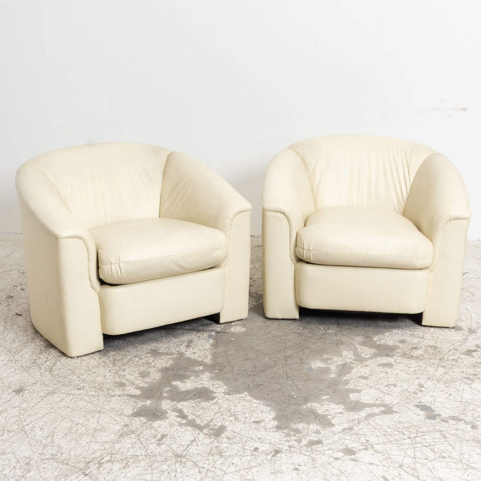 Pair of Modern White Leather Tub Chairs: (28" h x 37" w x 27" d Seat to floor 17" h)