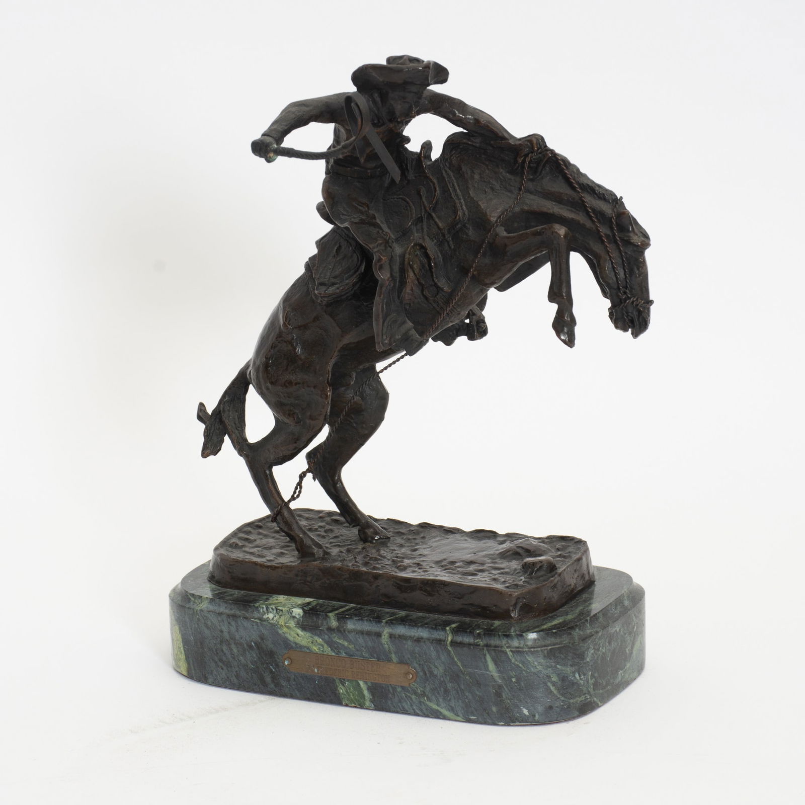 After Remington Patinated Bronze Statue: Bronco Buster On marble stand Signed (8 1/2" h x 9 1/2" w x 4 5/8" d) Good