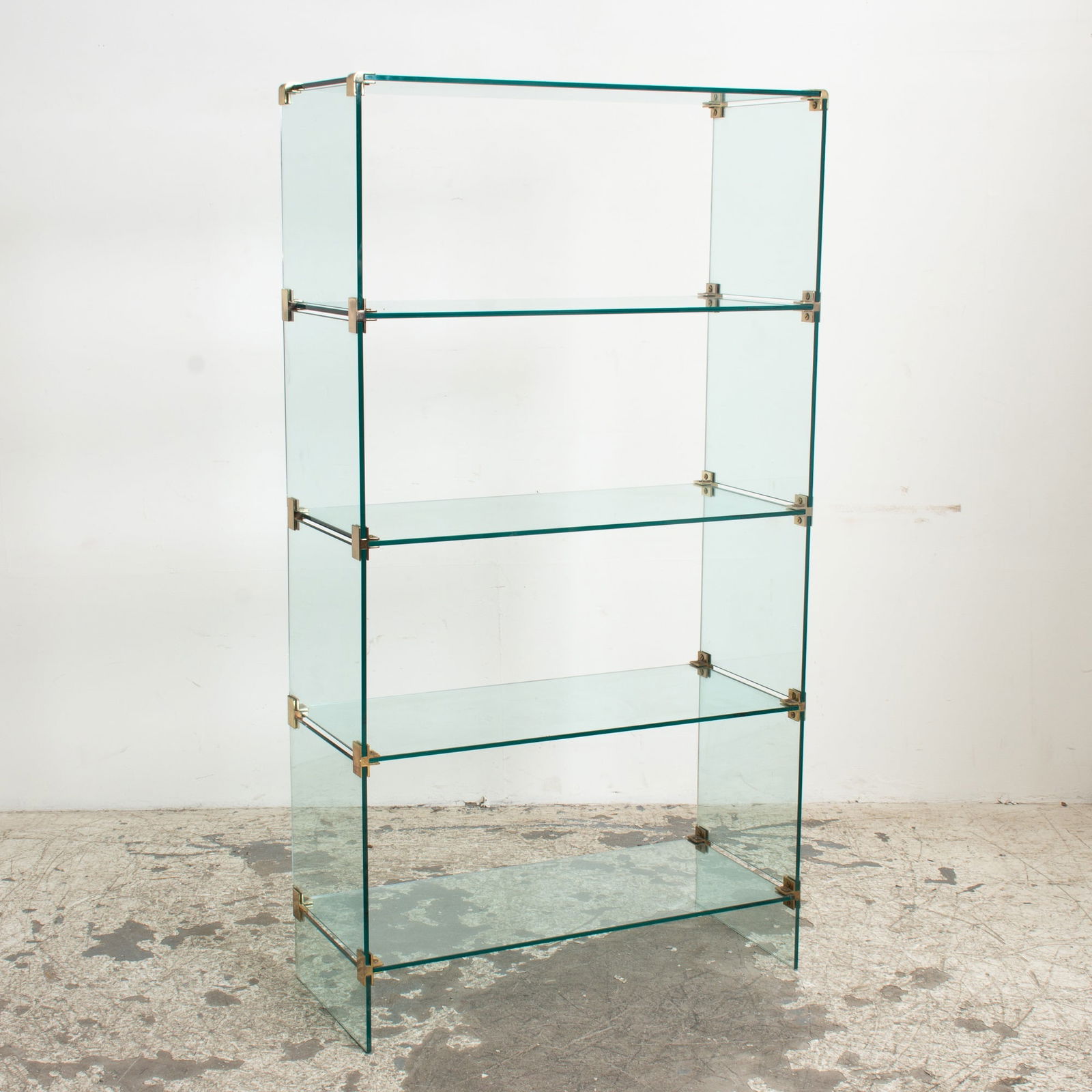Modern Brass and Glass Four-Tier Etagere: . (68 3/4" h x 37 1/4" w x 16" d) Scratches, chip to glass