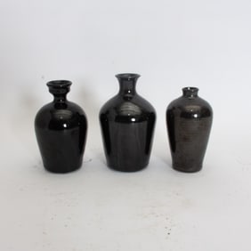 Group of Three Black Painted Ceramic Vases