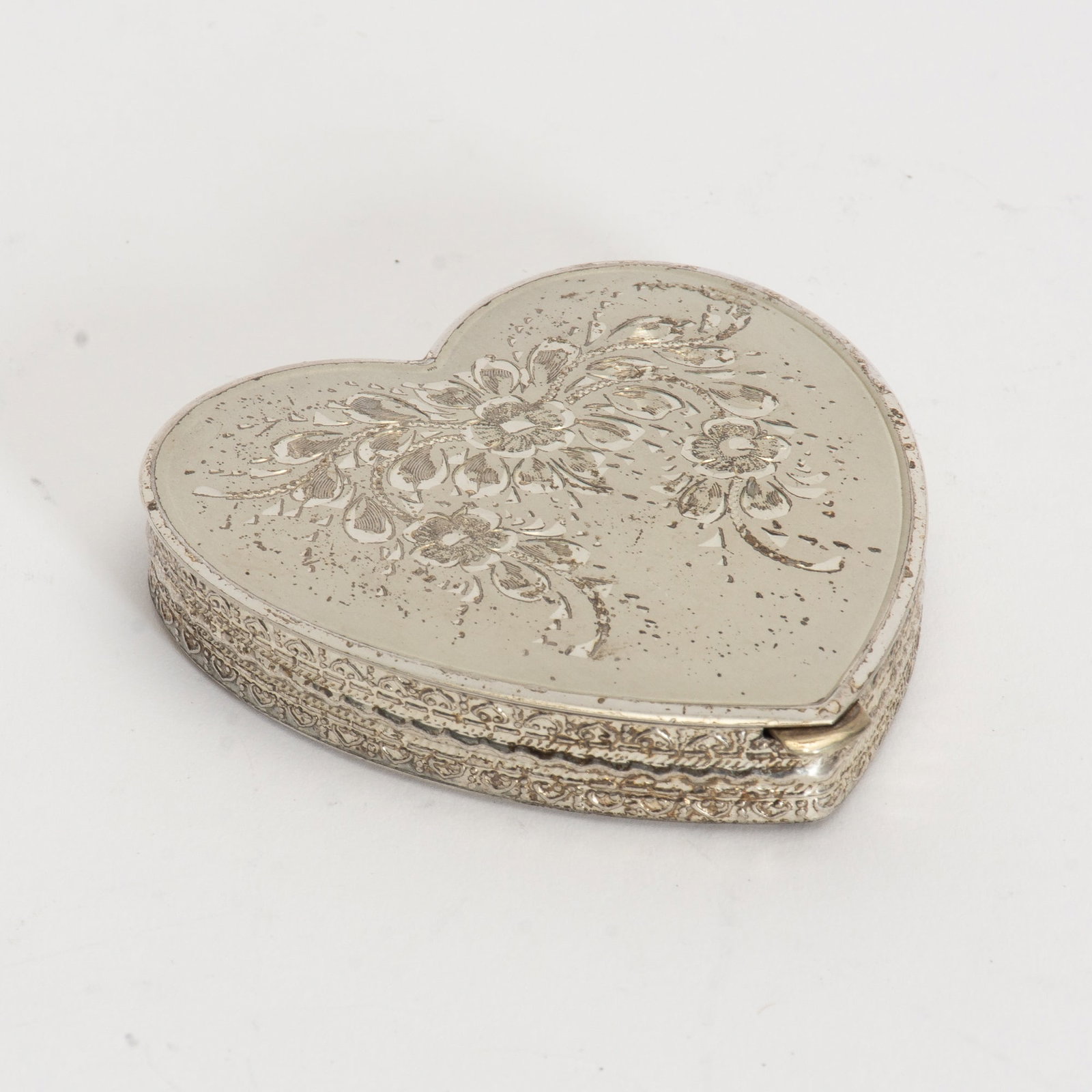 Heart Shaped Sterling Powder Compact: Ap. 2.03 ounces (3/8" h x 2 1/2" w x 25/8" d) Crack and silvering to mirror, puff worn out, crack to inner lining cover
