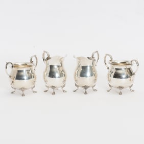 Two Sets of Sterling Cream and Sugar Jars