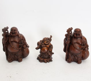 Group of Three Painted Resin Buddhas