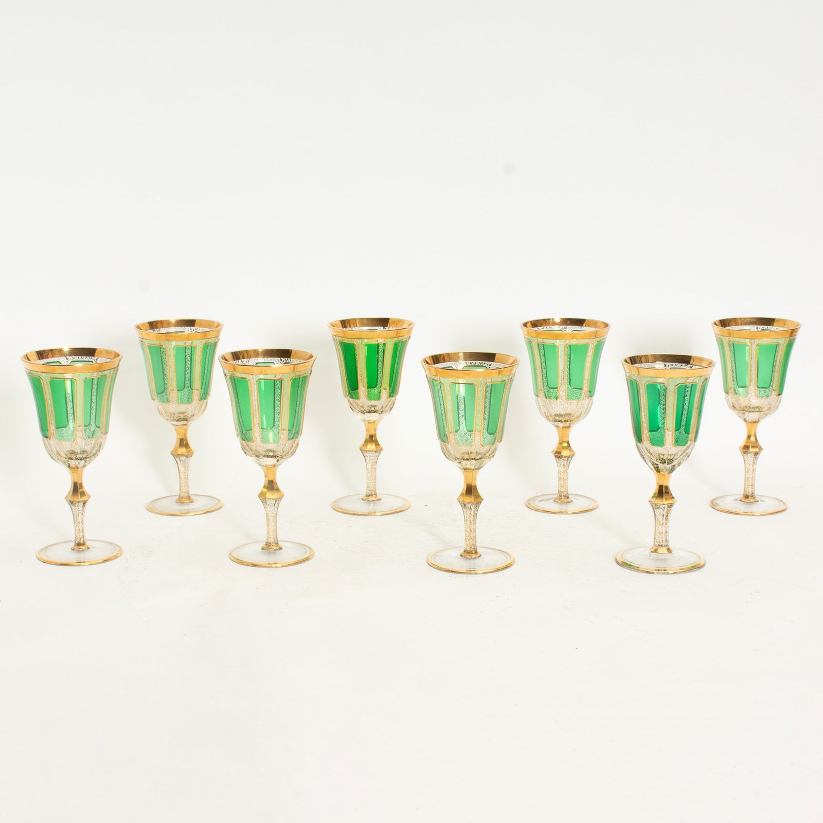 Set of Eight Green Bohemian Style Goblets: . (7 7/8" h x 3 3/4" dia) Rubbing to gilt