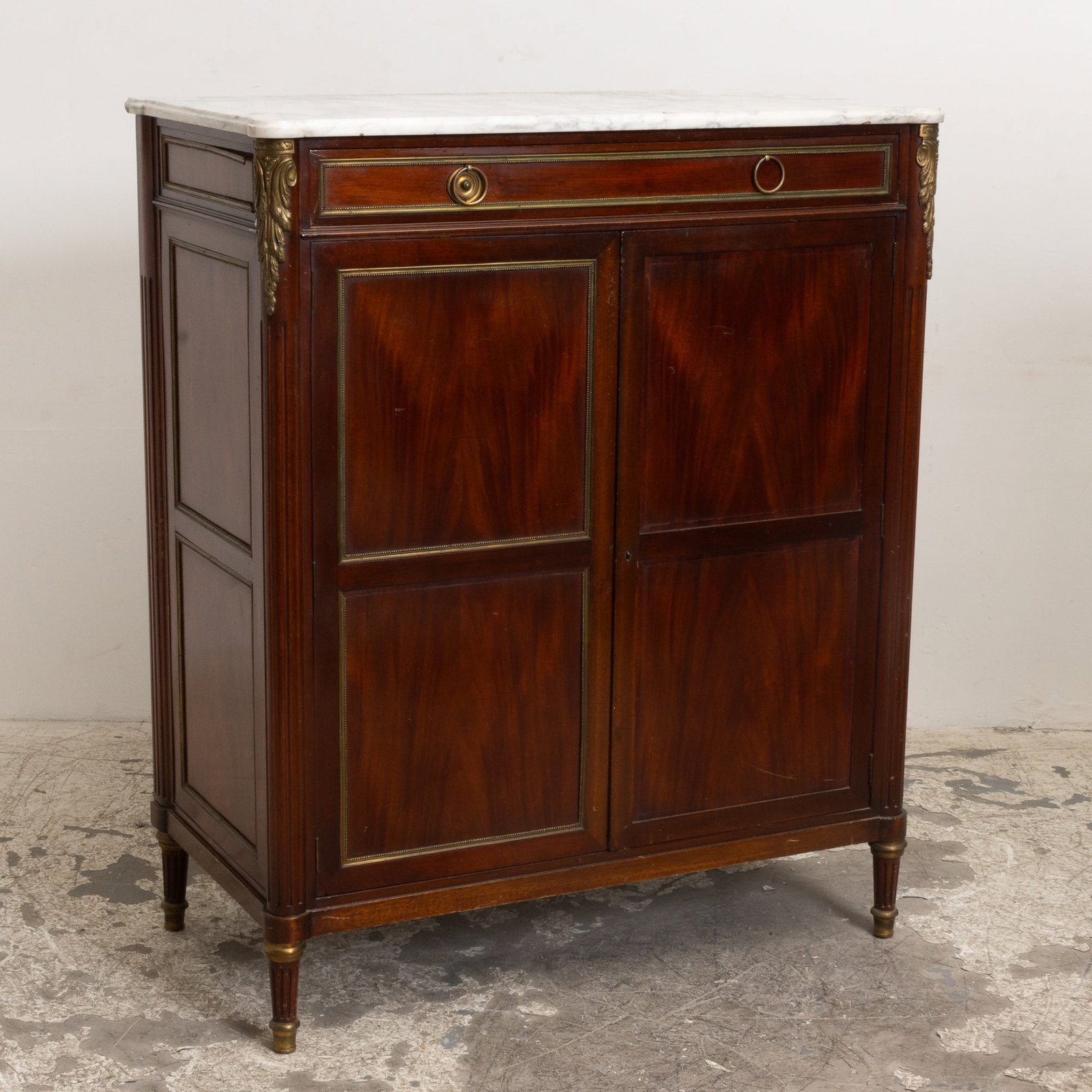 Louis XVI Style Mahogany Brass Mounted Marble Top Cabinet: . (52 1/2" h x 43 1/2" w x 23" d) Missing shelves