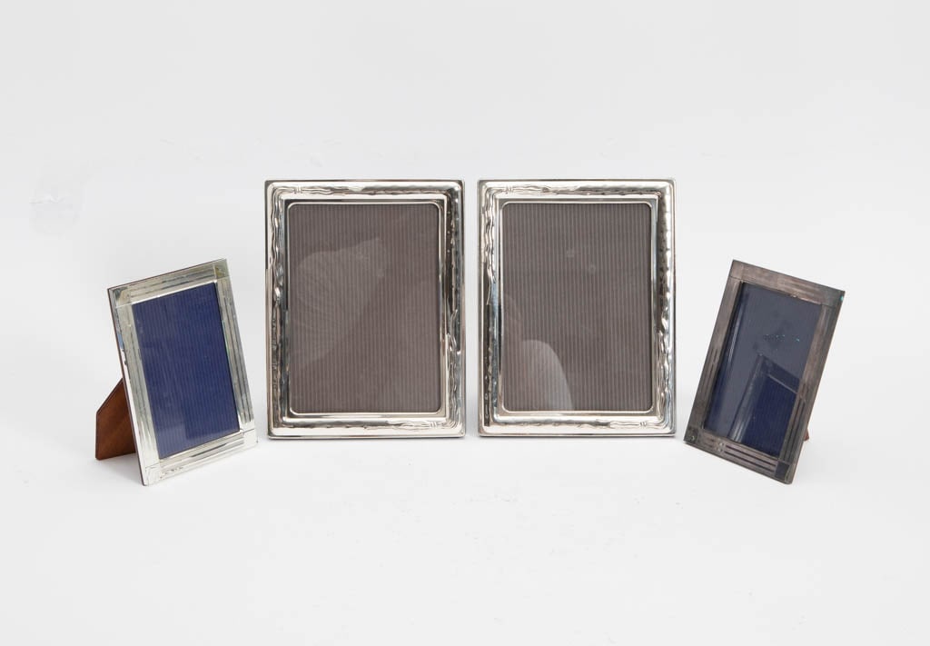 Group of Sterling Photo Frames: Four (Largest 8 1/2" h x 6 1/2" w) AS IS