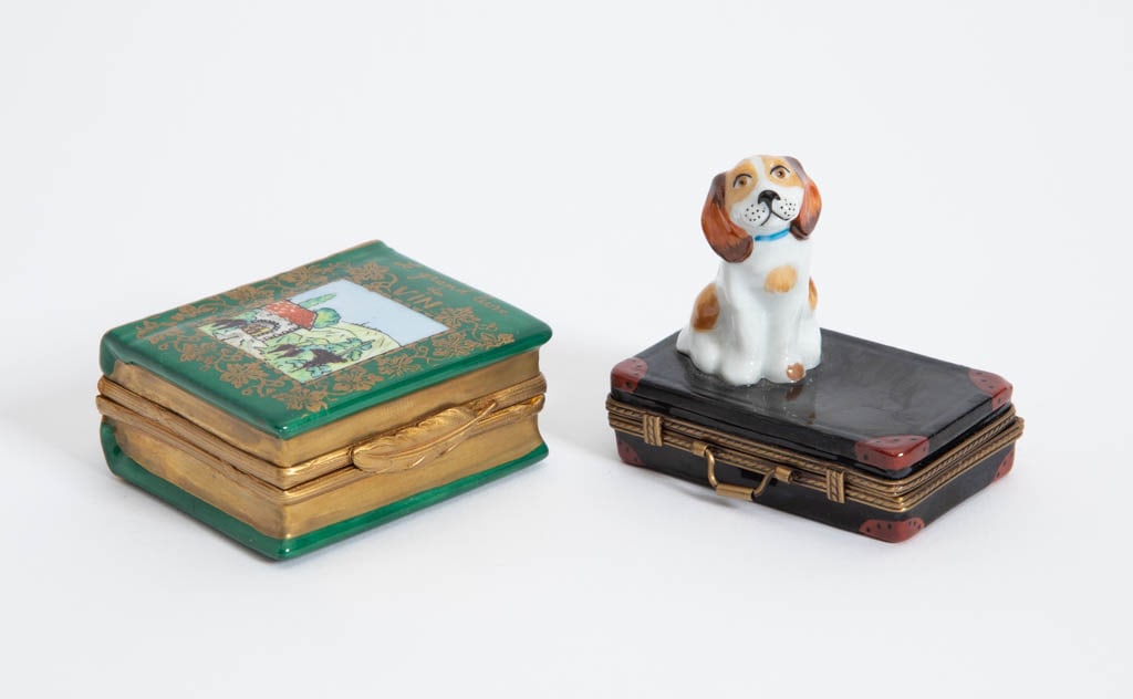 Two Limoges Porcelain Figural Pill Boxes: One book form, one suitcase with dog (Largest 1" h x 2" w x 1" d) good