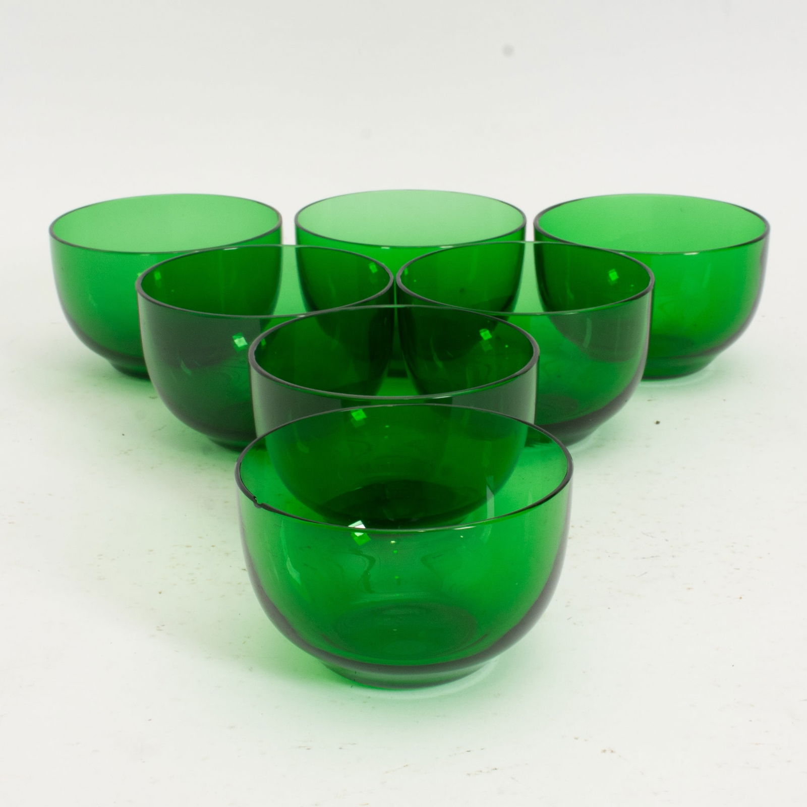 Set of Seven Green Glass Finger Bowls: . (3" h x 4 3/4" dia) Chip to one, scratches