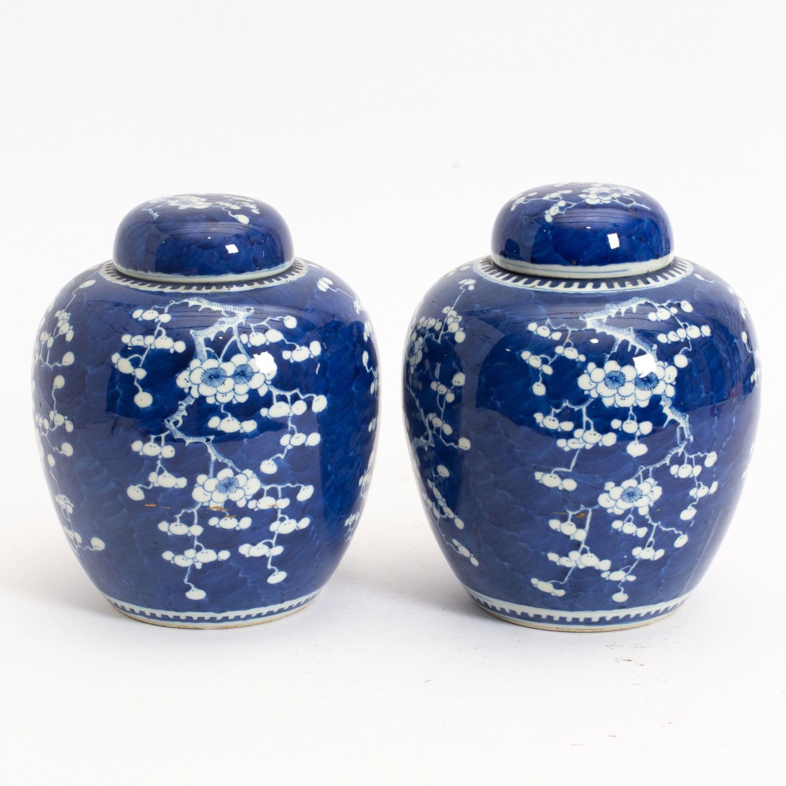 Pair of Chinese Blue and White Porcelain Ginger Jars: 19th Century Decorated in the 'Hawthorn' pattern. (10 1/4" h) Good