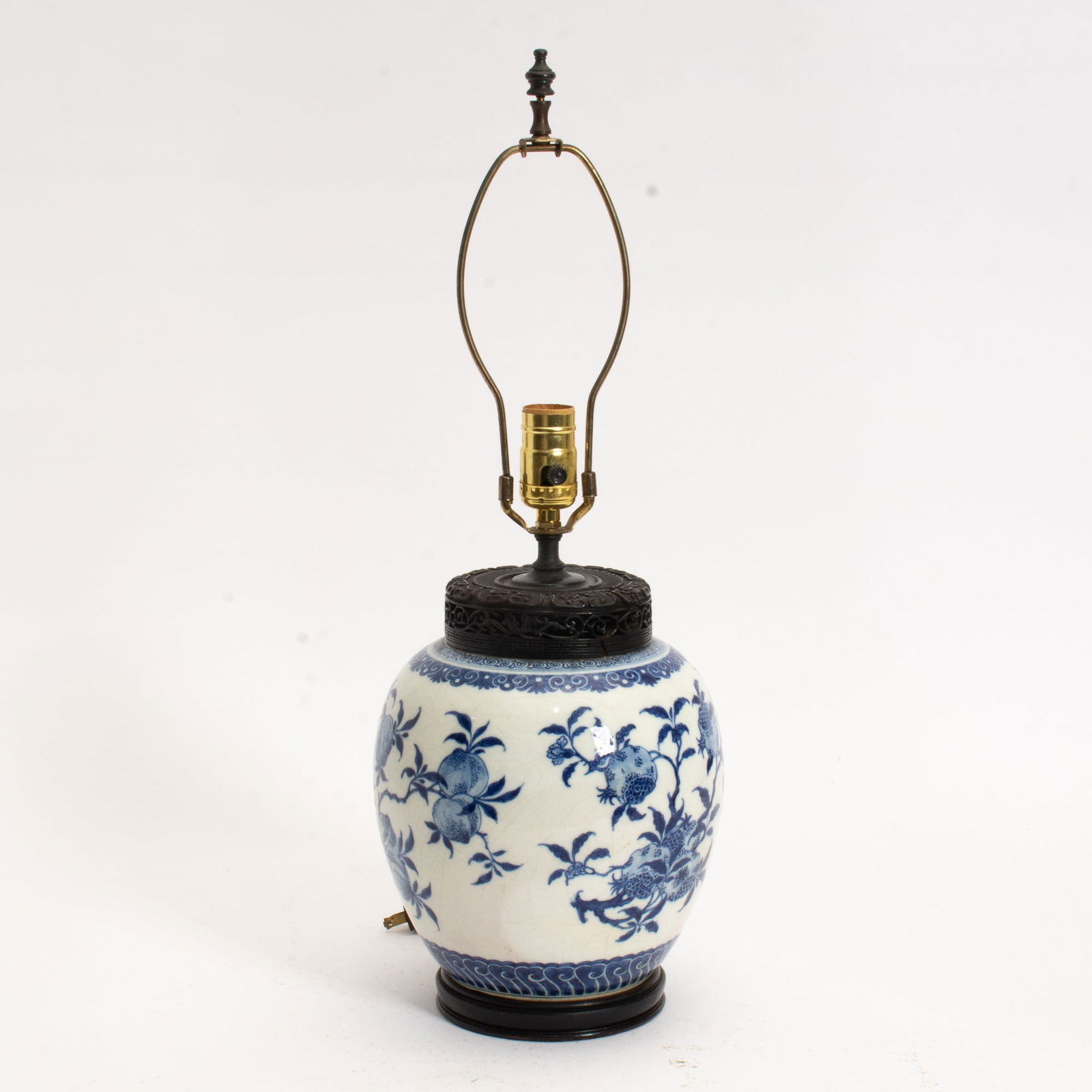 Chinese Blue and White Porcelain Jar: Mounted as a lamp Decorated with peaches and pomegranates. (Jar 10" h; Overall 22" h) Crack, untested