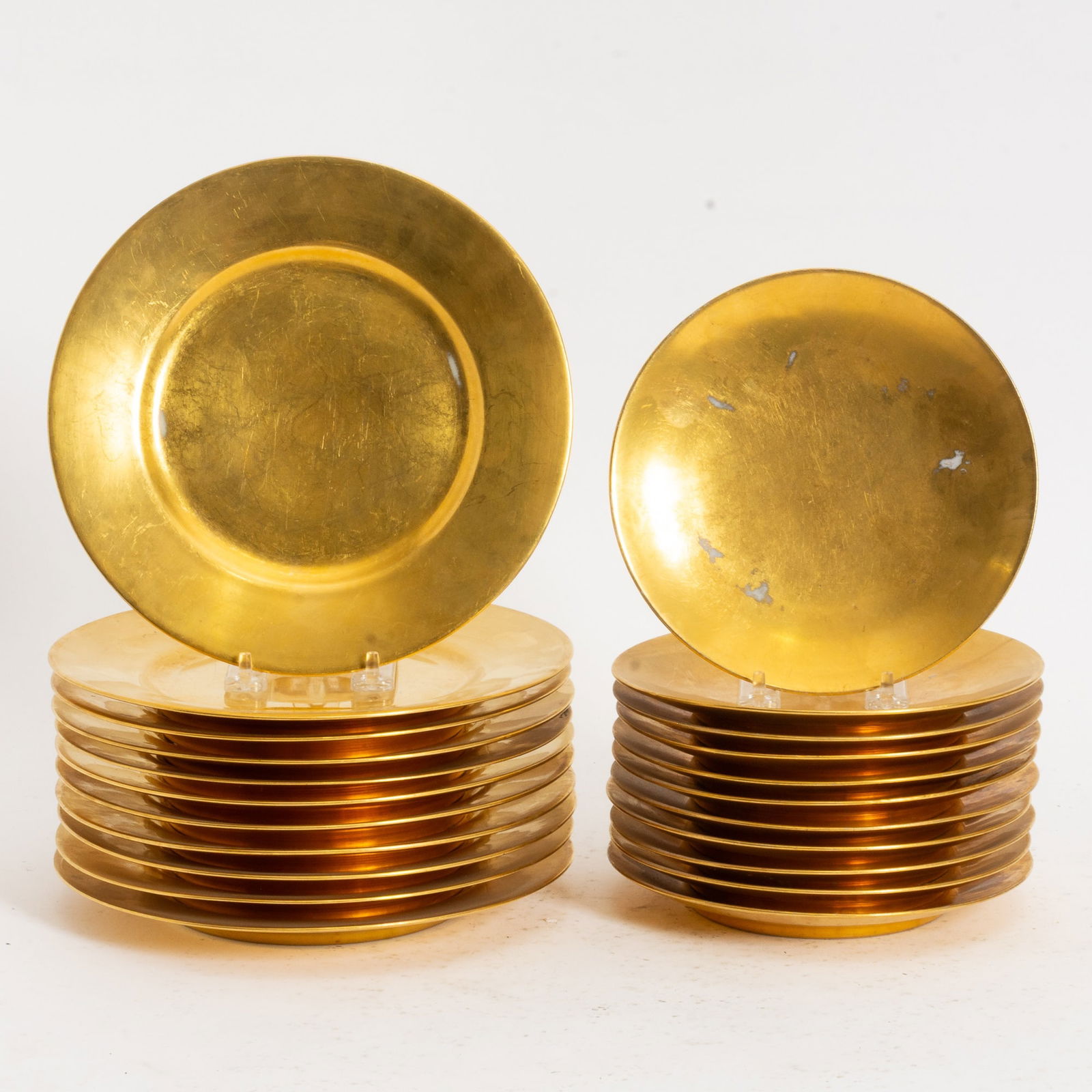 Group of Gilded Tableware: Black Knight Comprising 11 dinner plates, 10 salad plates (Dinner Plate 9 1/2" dia) Rubbing to finish, scratches, minor chips to edge