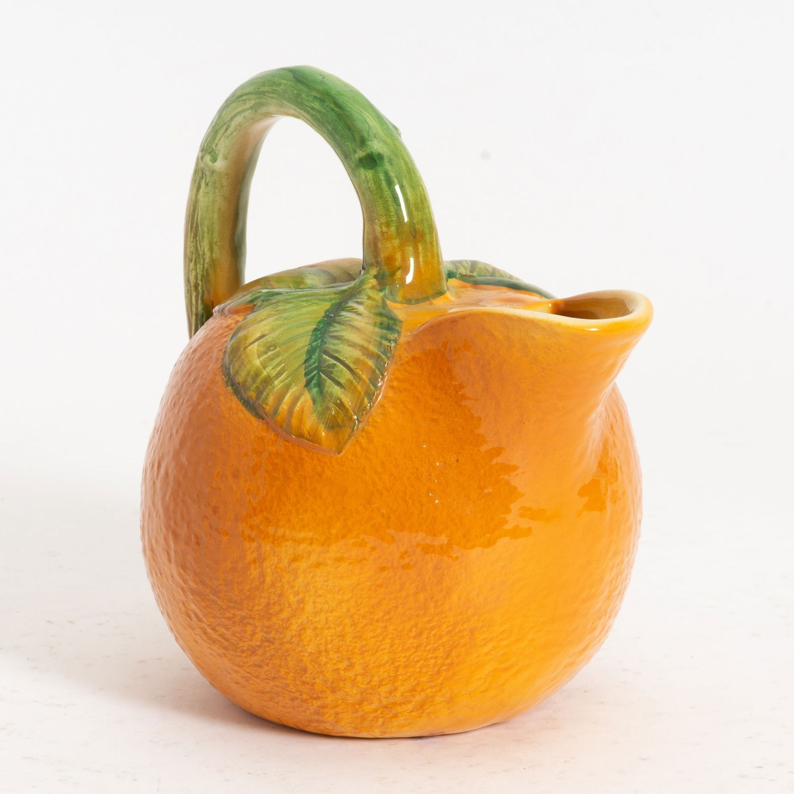 Italian Ceramic Orange Form Pitcher: . (7' h x 4" w x 7 1/4" d) Good