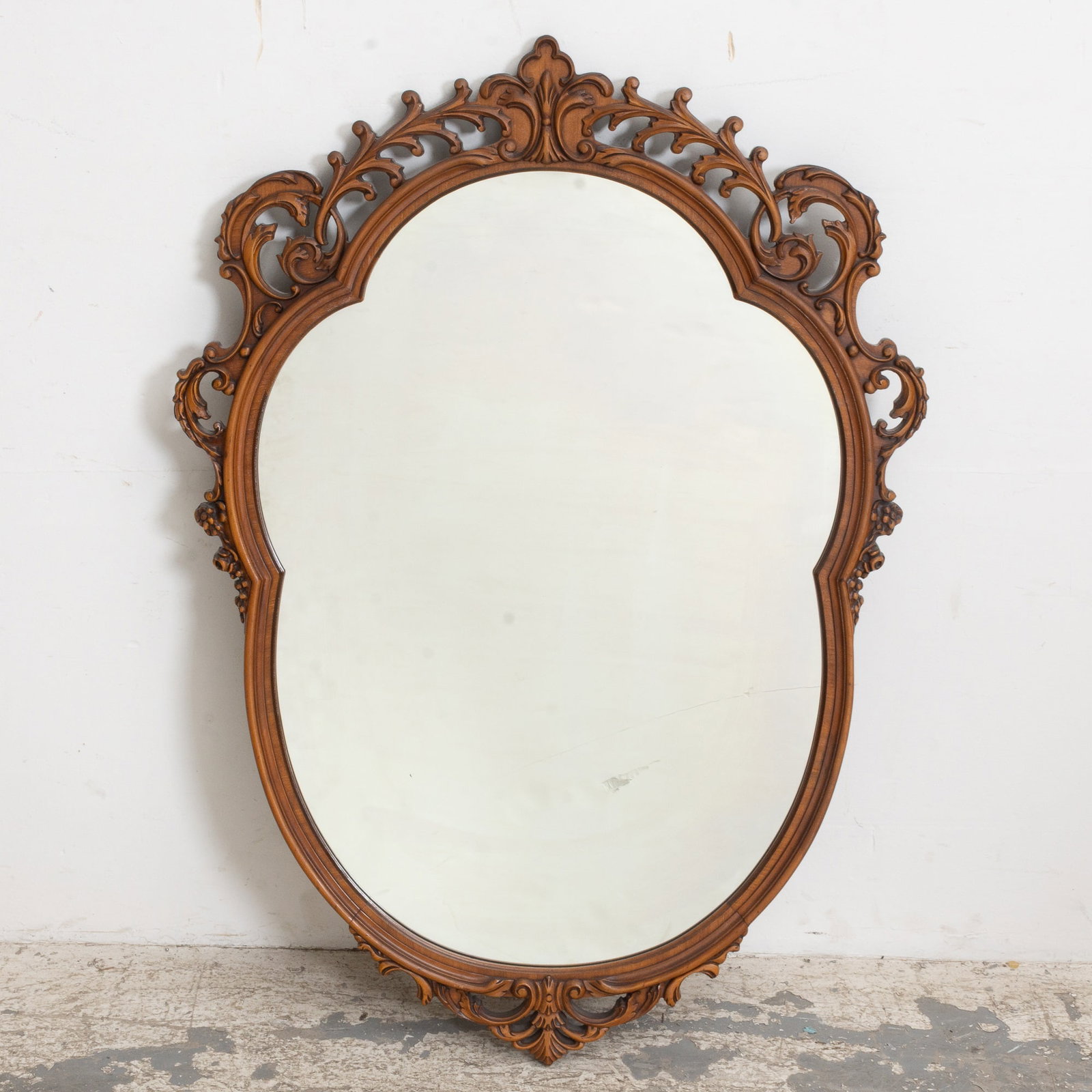 Carved Mahogany Framed Mirror: . (45" h x 33" w) scratches and dings