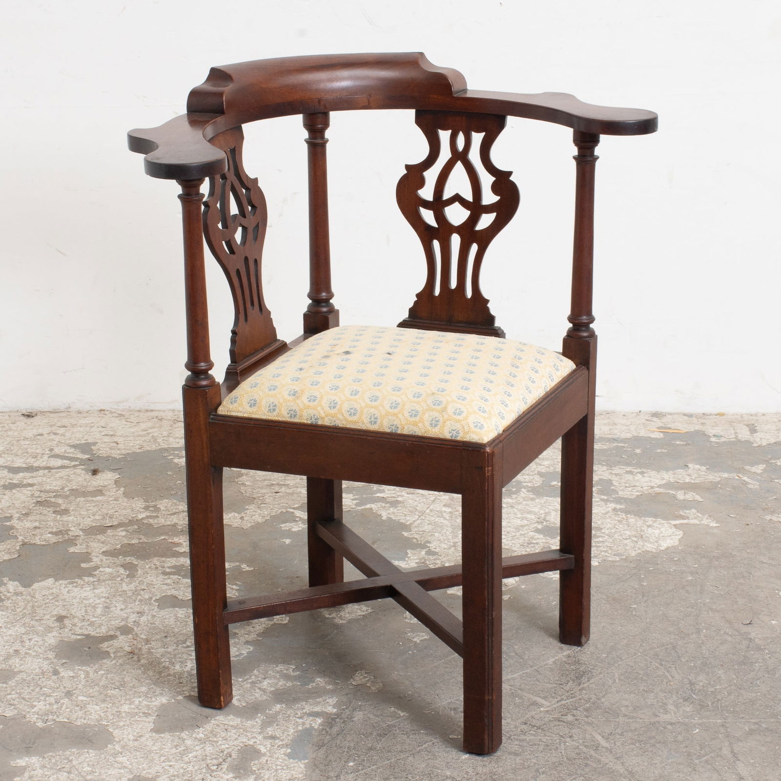 George III Mahogany Corner Chair: Third quarter 18th century (35" h x 30 1/2" w x 23" d Seat to foor 19 1/2" h) Corner blocks and stretcher replaced, scratches and dings