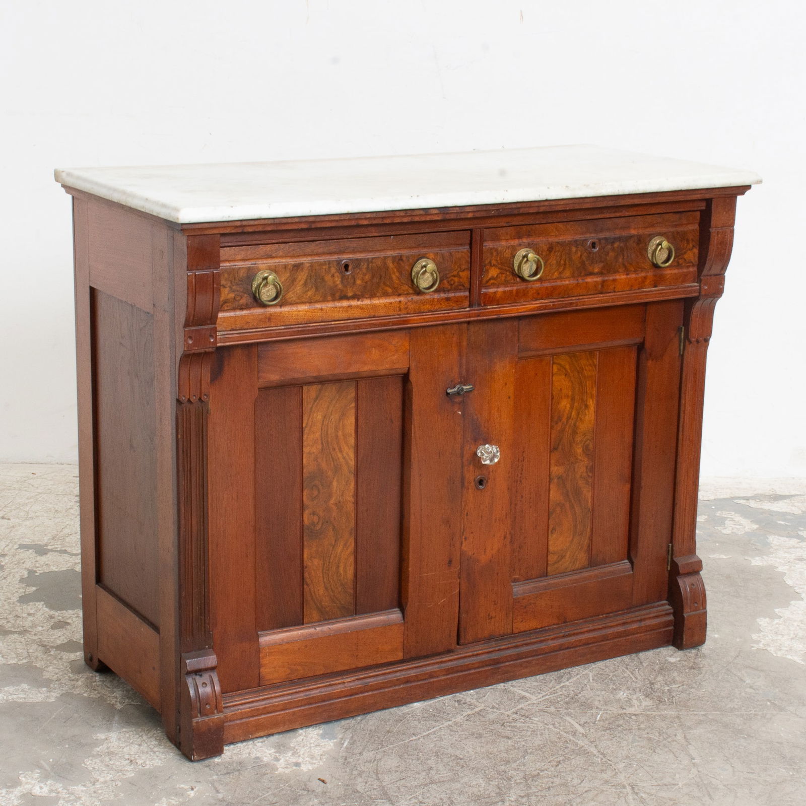 American Eastlake Style Walnut Marble Top Washstand: Late 19th century (35 3/4" h x 44" w x 20 3/4" d) Scratches, loose hardware, open seams to back