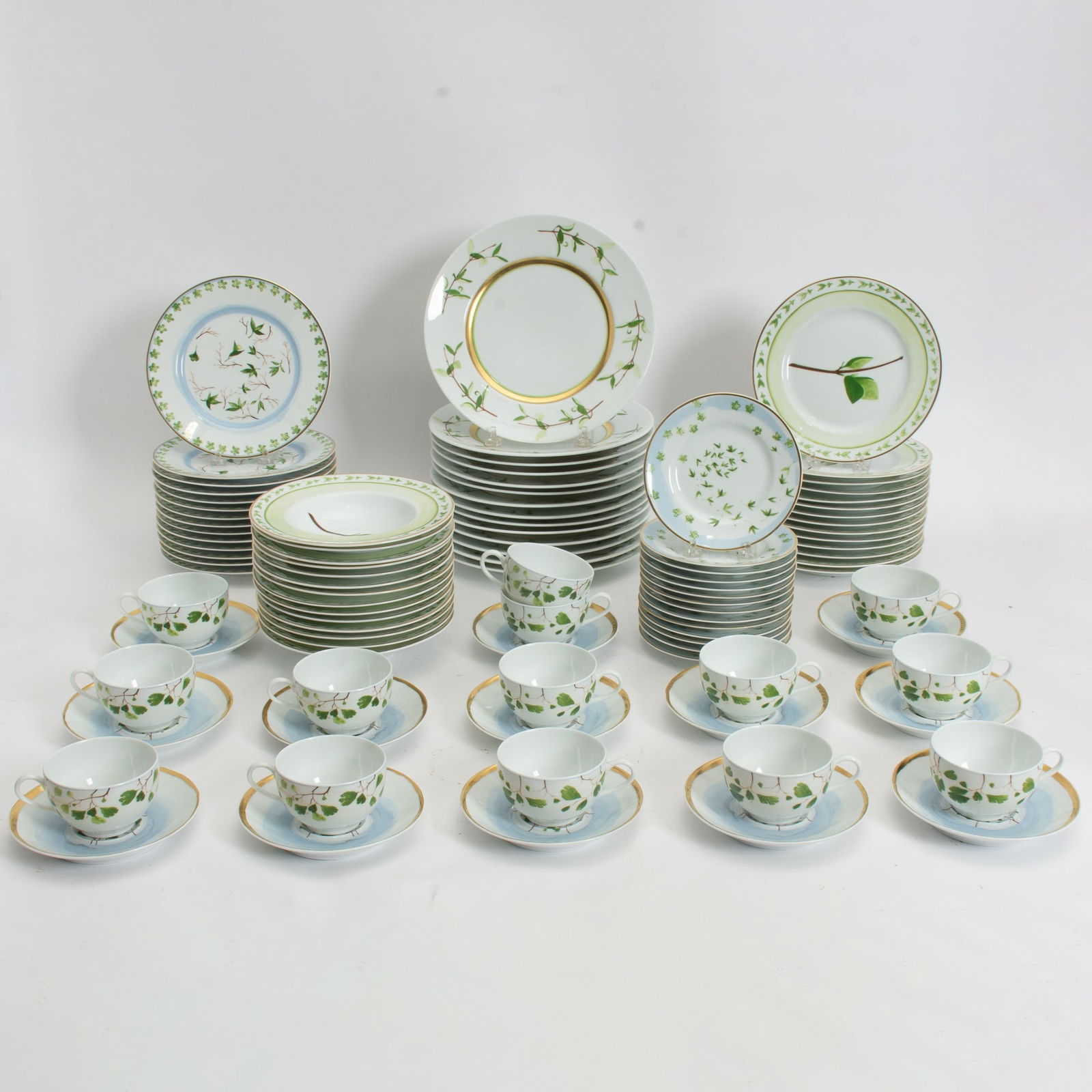 Raynaud "Verdures" Porcelain Dinner Set: Comprising 14 dinner plates, 14 side plates, 14 salad plates, 14 bread plates, 14 bowls, 14 cups, 13 saucers (10 3/4" dia) Light scratches