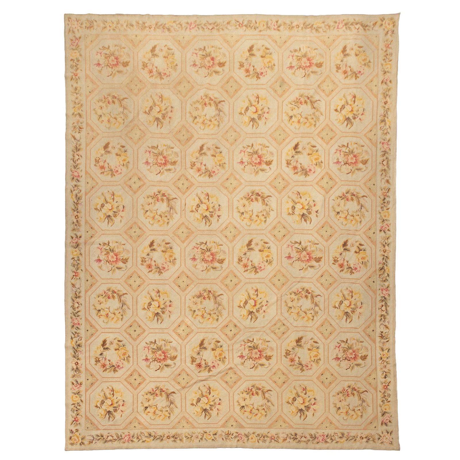 Needlepoint Carpet: China, Contemporary The overall pattern of polychrome wreaths and sprays on the ivory field is within a garland border. (133" x 105") Needs cleaning