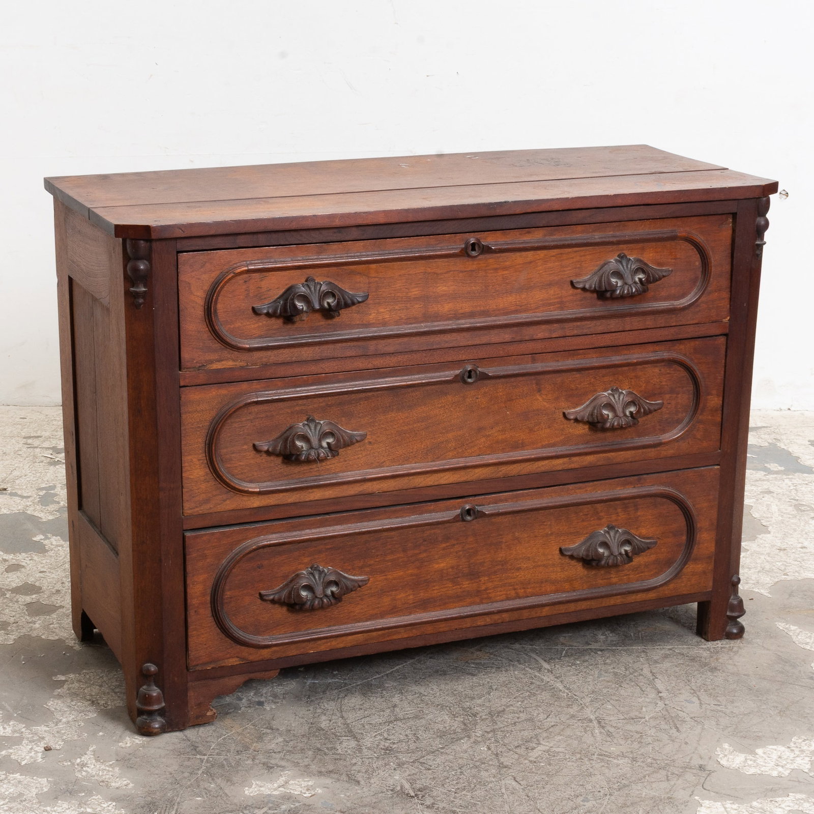 Eastlake Style Mahogany Dresser with Carved Handles: . (31 1/2" h x 44" w x 18 1/4" d) Open seams, scratches, chips, dings