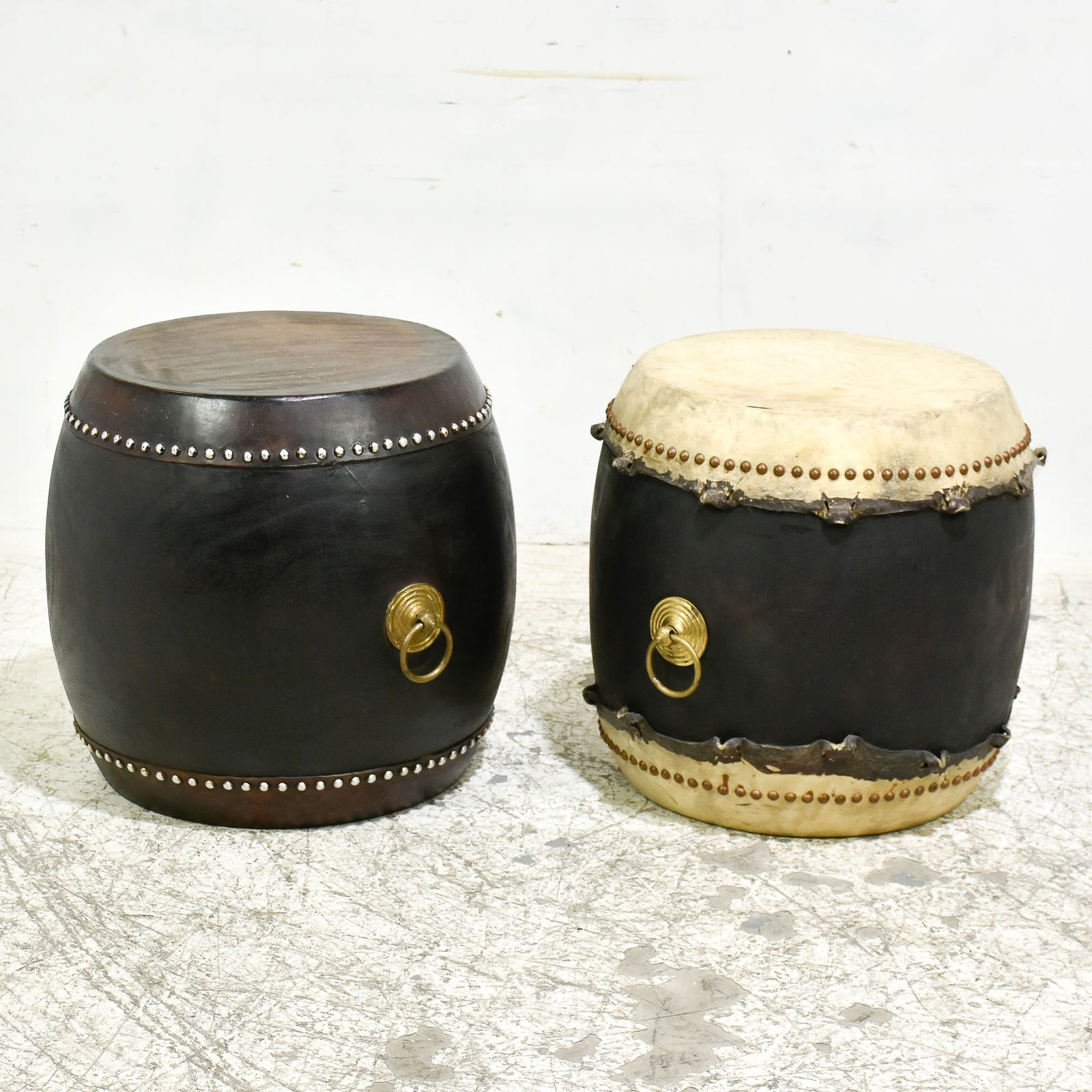Two Hide Covered Drum-form Tables: . * (Largest 23" h x 22" dia) Some light scratches