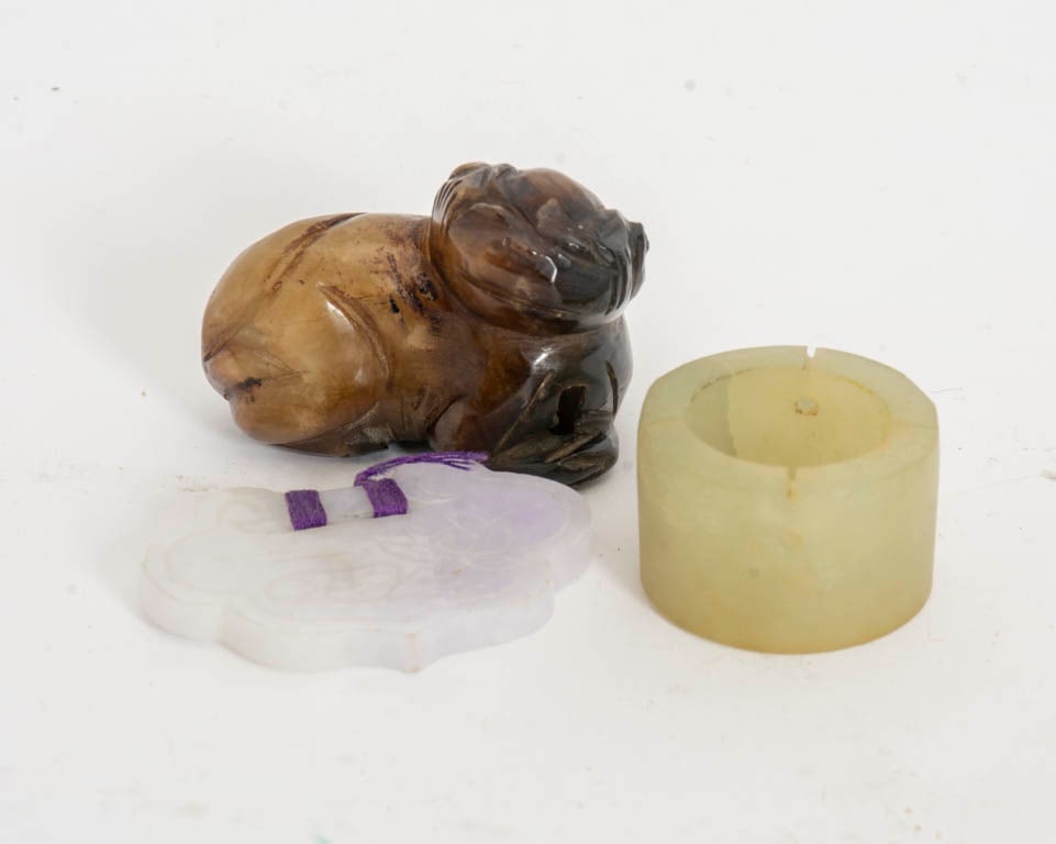 Assorted Group of Three Jade Articles: Comprising carved dog, archer ring, and pendant (1 1/4" h x 1 1/2" w x 1' d)