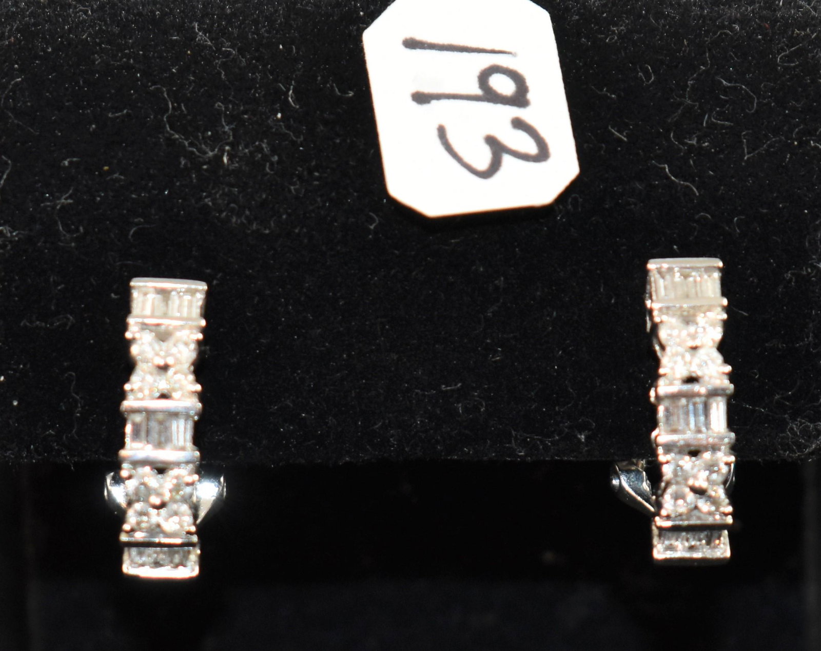 LADIES 1.42CTTW DIAMOND 14K WHITE GOLD EARRINGS: 14K WHITE GOLD DIAMOND EARRINGS. EACH EARRING CONTAIN (8) ROUND FULL CUT DIAMONDS, BEAD SET MEASURING 2.2 MM .04CT - CARAT: .32 TDW. (9) BAGUETTE CUT DIAMONDS, CHANNEL SET, MEASURING 2.0 X 1.5 MM .025