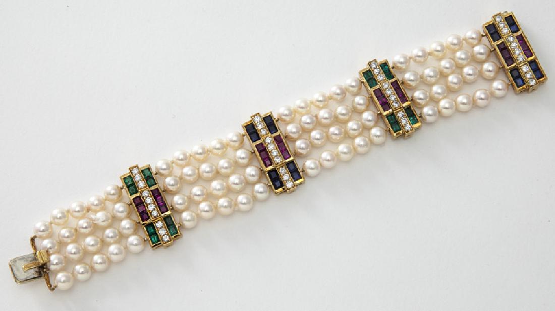 Julius Cohen 18K gold, diamond, sapphire, emerald,: Julius Cohen 18K gold, diamond, sapphire, emerald, ruby and pearl bracelet featuring four rows of 6-6.5mm white pearls with rose overtones, with four 18K gold spacers mounted with step cut emeralds, 2