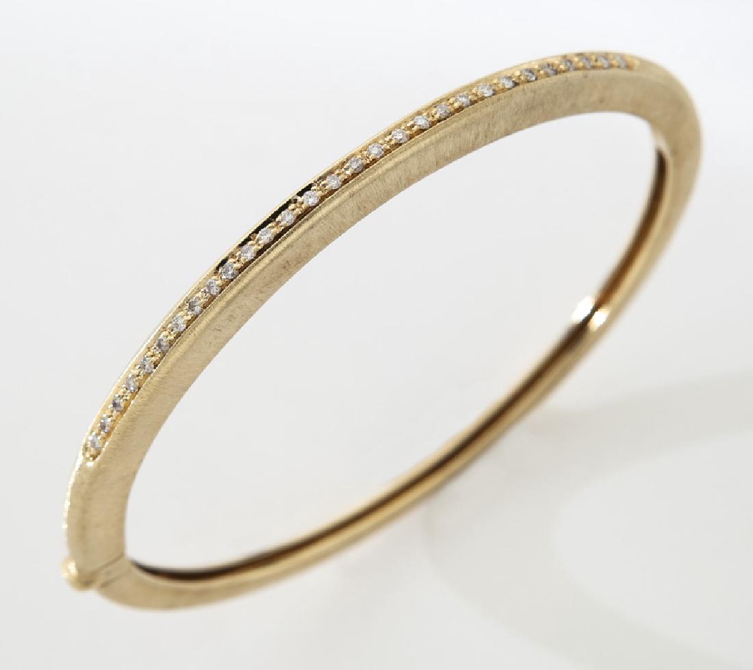 18K yellow gold and diamond bangle bracelet. (1 of 3)