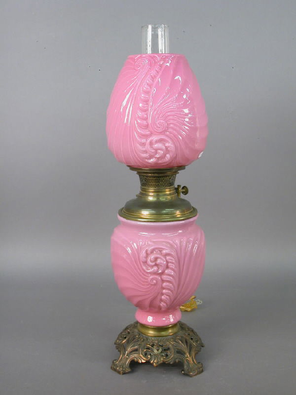 Bradley & Hubbard "Gone with the Wind" style: lamp with pink Art Nouveau-style font and globe. "B & H" parlor lamp has been electrified. 25.25"H x 7.25" base, Circa - 1900.