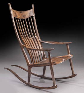 Sam Maloof rosewood long tailed rocking chair.: Sam Maloof rosewood long tailed rocking chair. Marked, "No. 12 2001, Sam Maloof d.f.a. r.i.s.d. Donated - The Alfreda Memorial Scholarship Fund sm". 46.5"H x 26.75"W x 47.25"L, Circa - 2001. PROVENANC