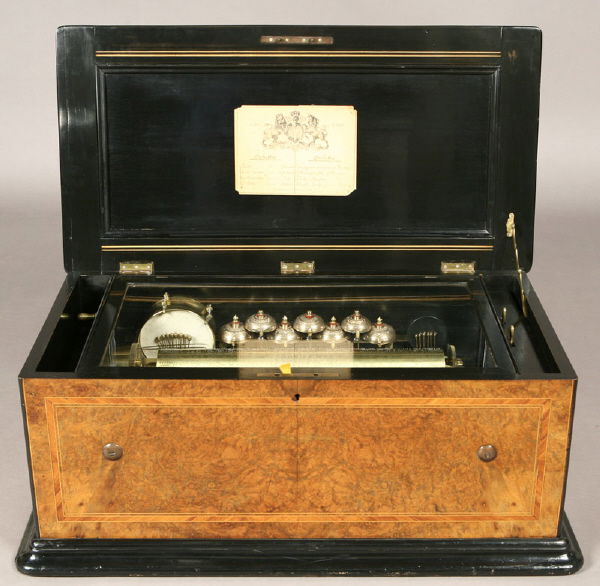 Swiss 17.75" cylinder, double comb music box,: with optional drums, bells, castanets and organs, (8) airs written on a George Bendon style tune sheet including: "Faust," "Le Roi Carotte," "La Triviata," "Gme Tell," "Les Joyeuses Commeres de Windso