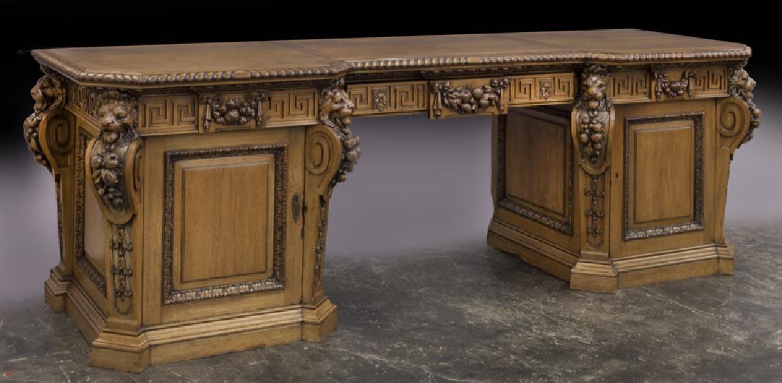 English Victorian faded mahogany sideboard,: English Victorian faded mahogany sideboard, the shaped top with gadroon carved molding on double pedestal base with Greek Key carvings and floral swags to the three drawers and sides, each corner of t
