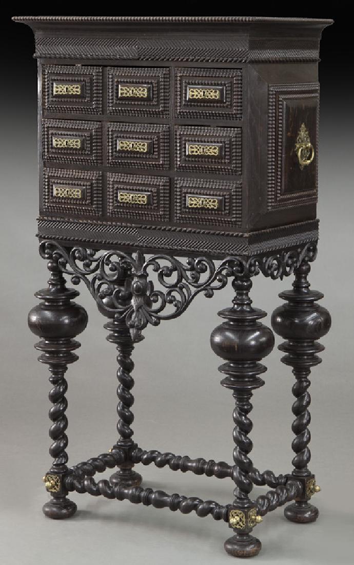 Portuguese 6-drawer contador,: Portuguese 6-drawer contador, the cornice with carved repeating diamond pattern over 9 drawers of varying size above scrolling apron raised on turned legs and stretchers, accented by gilt lock plates 
