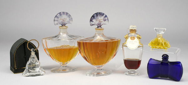 (6) Baccarat perfume bottles including: (6) Baccarat perfume bottles including: (2) "Guerlain Paris" Shalomar perfume bottles; (1) Guerlain's "Coque d' Or"; (1) "Nuit de Noel"; (1) "Joy."; (1) Houbigant "Subtilite" sitting Buddha with origi