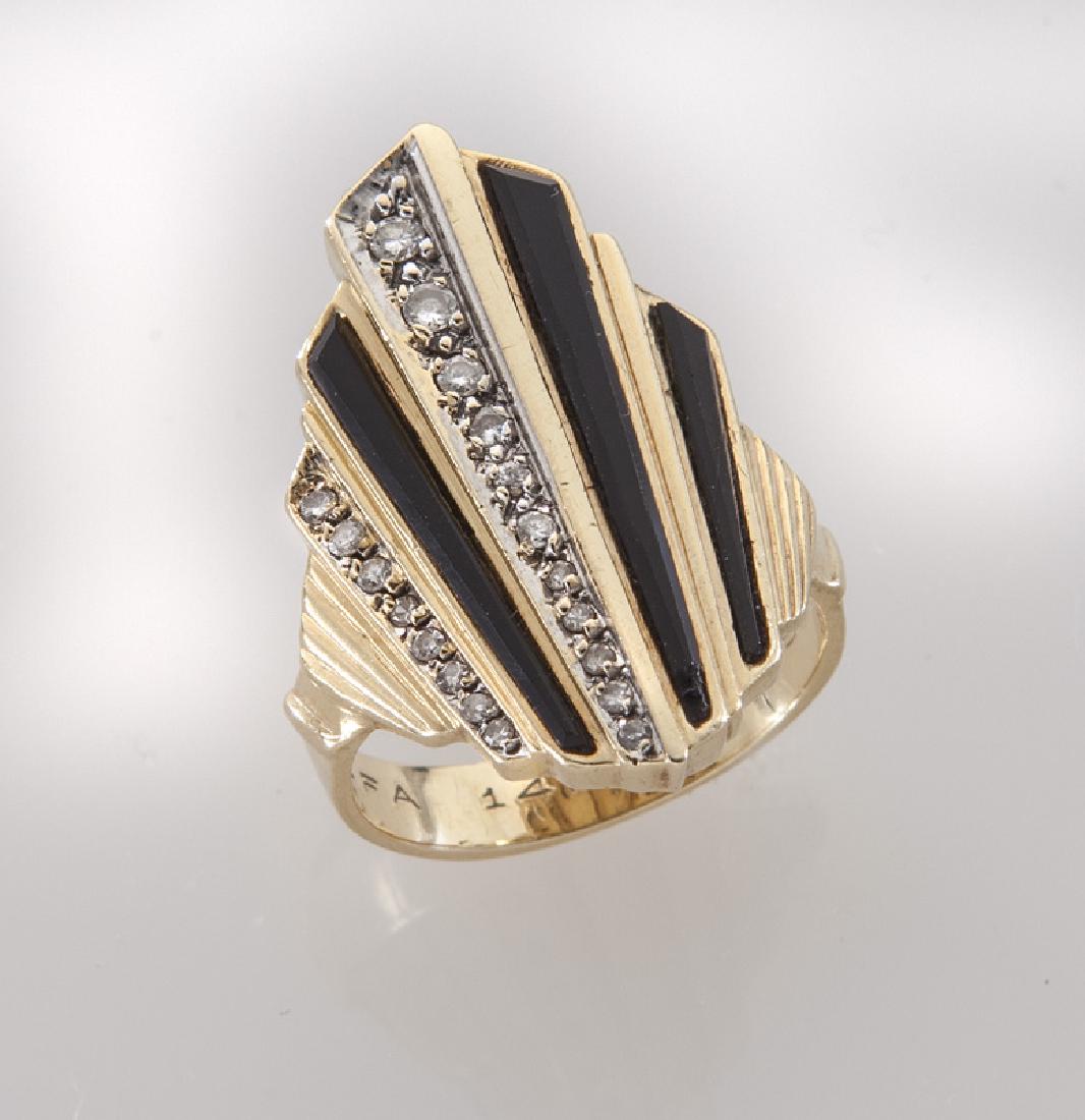 Erte 14K gold, diamond and onyx ring.: Erte 14K gold, diamond and onyx ring. Stamped, "CFA 14K 61/250". 7.4 grams. Size 7, Circa - 20th C.