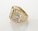 18K gold and diamond ring featuring a central - 3