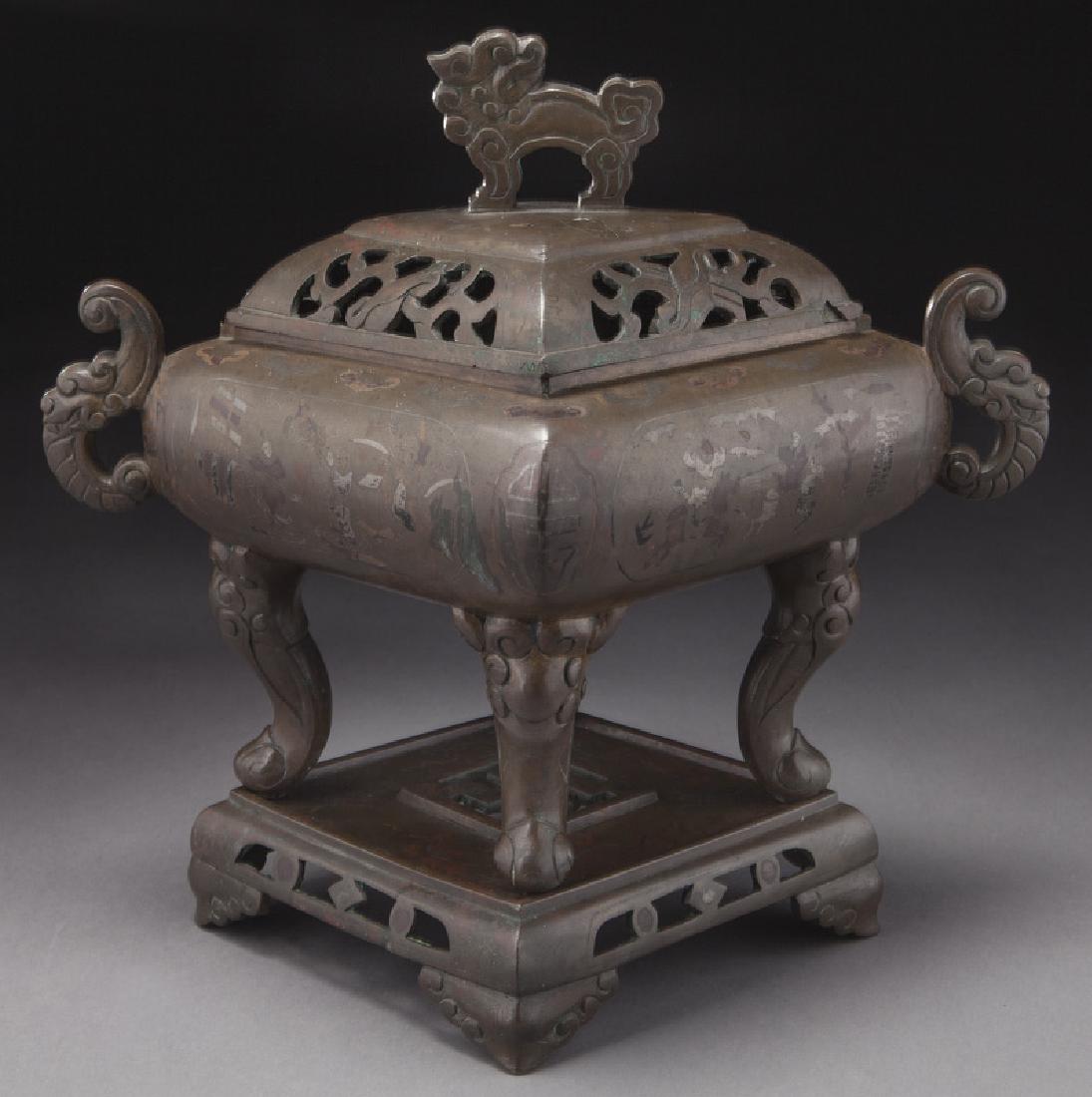 Vietnamese bronze censer in lozenge form,: Vietnamese bronze censer in lozenge form, complete with original stand and cover. The body decorated with scenes of the glorious return of a successful candidate from the imperial exam with silver and